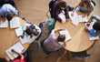 © Monkey Business - Overhead Shot Of High School Pupils In Group Study Around Tables