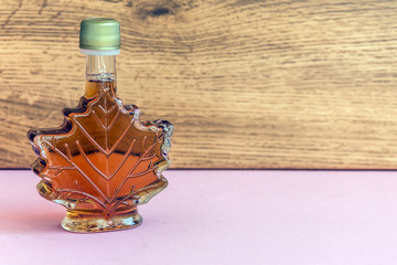 maple syrup in a bottle maple leaf shape. suovenir from canada.
