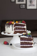 Canvas Print - Festive chocolate cake with berry jelly, creamcheese and chocolate stains in home interior.