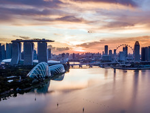 Aerial Drone View Of Singapore City Skyline At Sunset