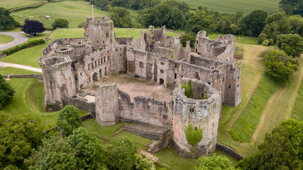 Canvas Print - Aerial view of the ruins of a large medieval castle (Raglan Castle, South Wales, UK)