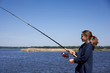 © paffy - Little girl with a fishing rod fishing on river in a summer day