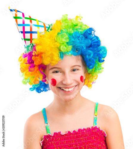 Fotografía Funny little girl in clown wig with red spots on her cheeks isolated on white ba