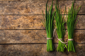 fresh chives on wooden rustic background