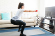 Woman going squats at home
