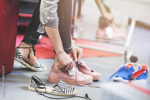Fotografía Woman trying shoes in store