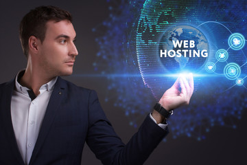 Business, Technology, Internet and network concept. Young businessman working on a virtual screen of the future and sees the inscription: Web hosting