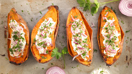 baked sweet potato with cheese cream and parsley