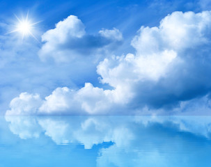 Blue sunny sky. Summer background with blue sky and white clouds