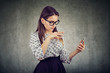 © Feodora - Young woman using a smartphone
