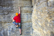 © zhukovvvlad - Climber in a helmet climbs up.