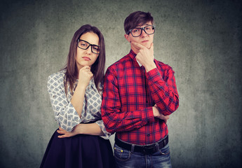 Wall Mural - Skeptical young man and woman