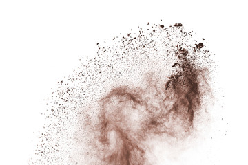 Wall Mural - brown powder explosion isolated on white background.