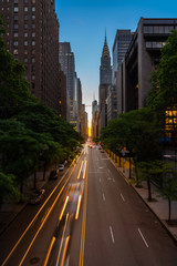 Wall Mural - Manhattanhenge when the sun sets along 42nd street in NY