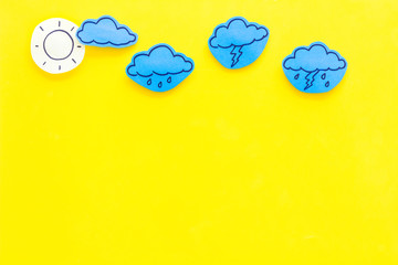 Wall Mural - modern weather icons set on yellow background top view copy space