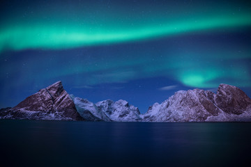 snow mountain with aurora in the background/ travel concept world explore northern light