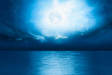 Night Sky With Full Moon And Reflection In Sea,  "Elements Of This Image Furnished By NASA"
