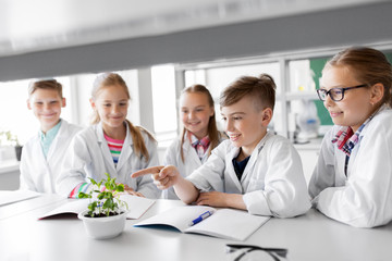 Sticker - education, science and school concept - kids or students with plant at biology class