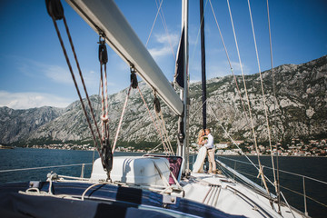 Wall Mural - Wedding couple on the luxury yacht sailing down the sea, Montenegro