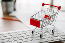 Shopping Cart On A Laptop Keyboard. Ideas About E-commerce, E-commerce Or Electronic Commerce Is A Transaction Of Buying Or Selling Goods Or Services Online Over The Internet.