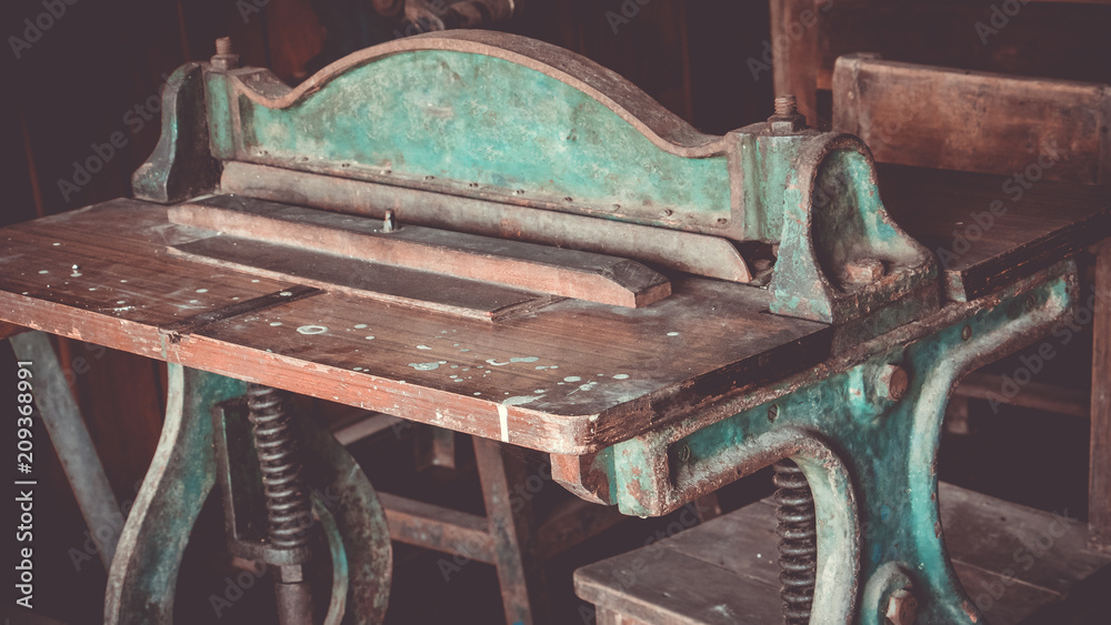 Close up of set old antique letterpress printing black ink machine ...