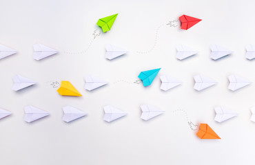 Wall Mural - group of paper planes in one direction and with one group individual pointing in the different way. 