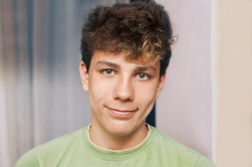 Portrait of a beautiful teenager with dark hair with a nice smile