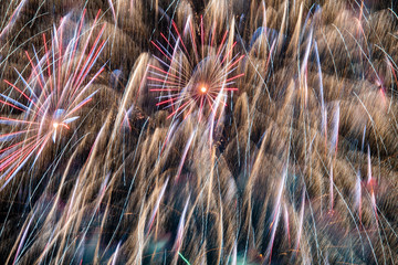 Massive explosion of fireworks fills the entire night sky