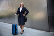 © elnariz - Warm friendly older female executive CEO entrepreneur traveling abroad for business