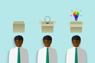 Wall Mural - thinking out of the box concept with black businessman having a cardboard box above his head and col
