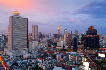 Wall Mural - Aerial view of Bangkok skyline and skyscraper with BTS skytrain in Bangkok downtown.Bangkok is the most populated city in Southeast Asia.Bangkok , Thailand