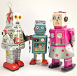 © charles taylor - three retro toy robots together