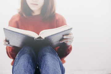 Wall Mural - Soft focus hands woman open the holy bible. Sunday reading