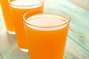 Fresh citrus juice in glass on table, closeup