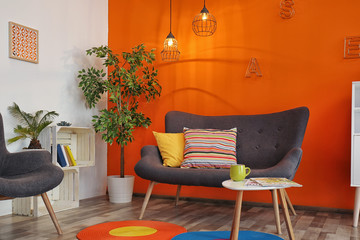 Poster - Interior of modern living room with pillows on sofa