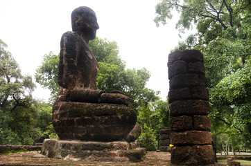 View landscape of buddha statue at Wat Phra Sing in ancient building and ruins city of Kamphaeng Phet Historical Park