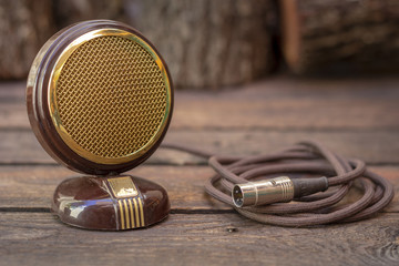 Close up shot of a antique 50s microphone with cables and box, vintage styleconcept.