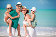© travnikovstudio - Happy family with kids on the beach together
