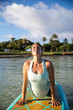 © Deborah Kolb - Sunny morning work out a pretty young woman in SUP Yoga upward dog Pose in Ala Moana Hawaii