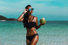 Beautiful Sexy Amazing Young Woman On The Beach, Excellent Time, Tanned Radiant Skin, Long Hair, Black Bikini, Mirror Sunglasses, Fashion, Glamor, Vacation On A Tropical Island,  Low Key Photos