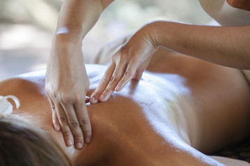 Wall Mural - Young woman relaxing after massage on spa treatment