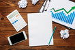 © fotofabrika - Top view of business paper chart or graph on wooden table