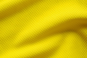 Yellow color football jersey clothing fabric texture sports wear background, close up