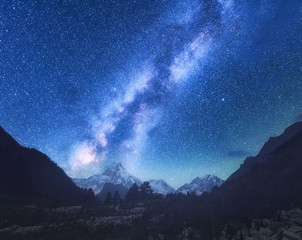 Wall Mural - milky way. amazing scene with himalayan mountains and starry sky at night in nepal. high rocks with 