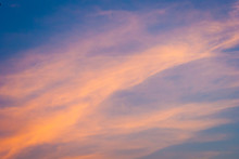 Orange Cloud On A Blue Sky Background. Amazing View During Sunset