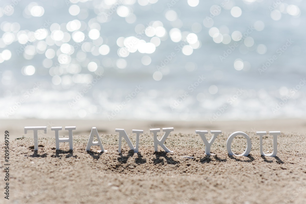thank you word drawn on the beach sand Stock Photo | Adobe Stock