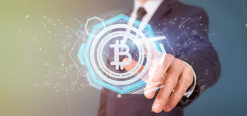 Poster - Man holding a technology Bitcoin icon on a circle 3d rendering