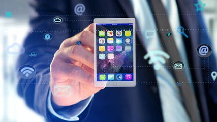 Poster - Businessman holding a tablet surrounding by app and social icon - 3d render