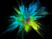 Colored Powder Explosion On Black Background.