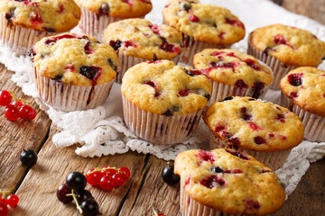 Wall Mural - Delicious organic muffins with a berry mix close-up. horizontal